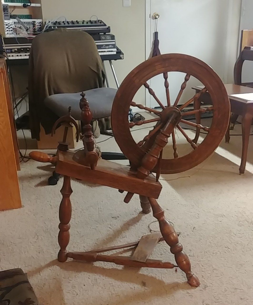 My spinning wheel, the day I got it home.  A bearing is missing, so the flyer is not properly mounted